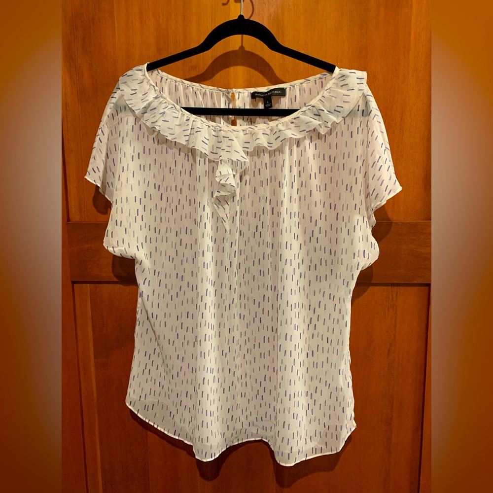 Banana Republic white short sleeve blouse with blue accents.